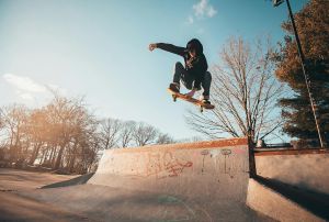 Skateboarder mid-air at local skate park