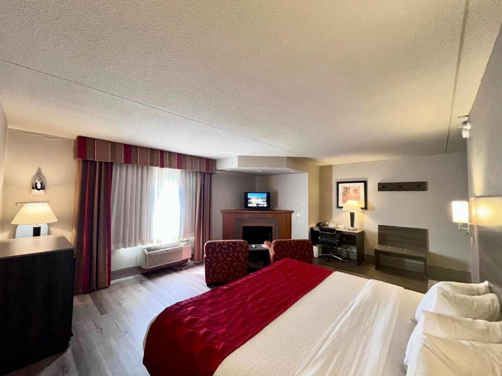 Interior view of a comfy room at Ramada Inn Hotel in Platte City, MO