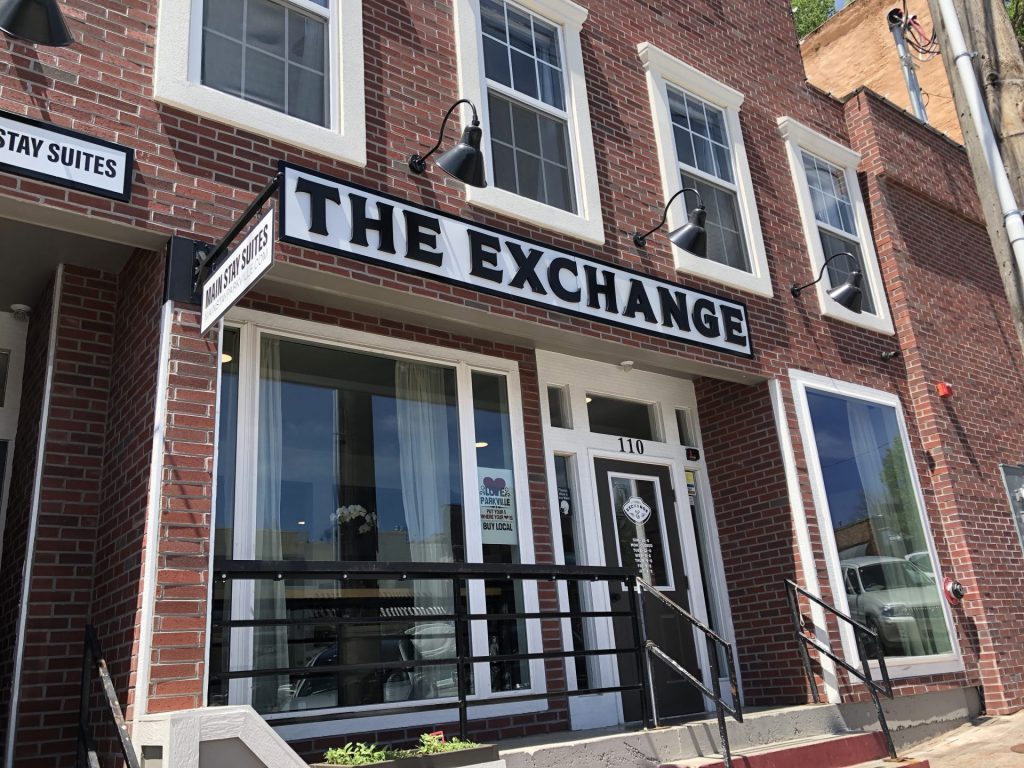 Exterior of The Exchange by Park House in Parkville, MO, featuring modern design set along Parkville’s historic streets.